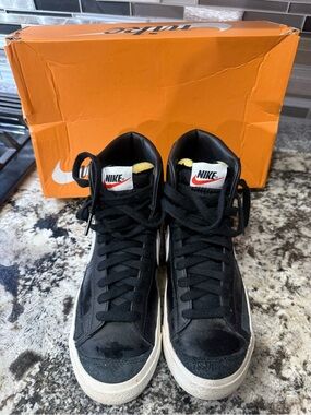 Nike Black High-Top Sneakers with White Soles and Red Swoosh Accent